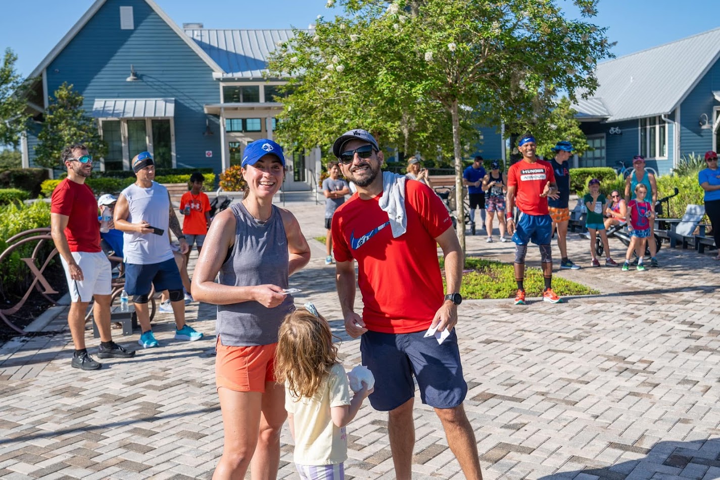 Pablo handing out finisher rewards to a family